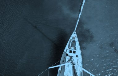 top down image of boat, blue filter